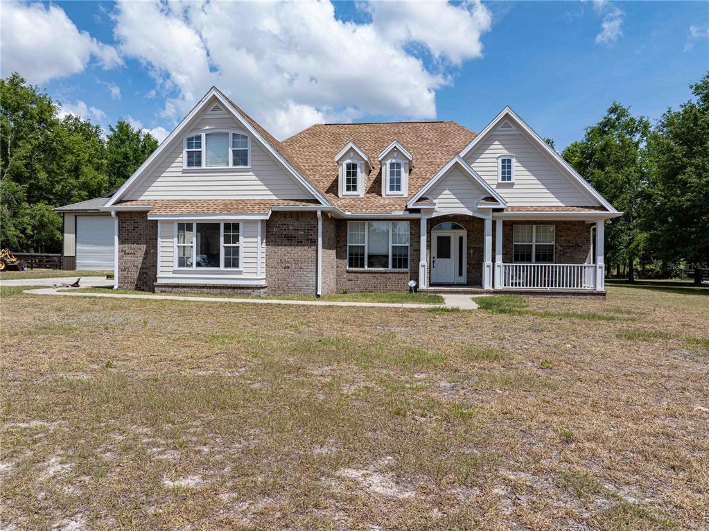 15527 194th Place O'Brien, FL 32071 - Photo 2 of 40 a front view of a house with yard