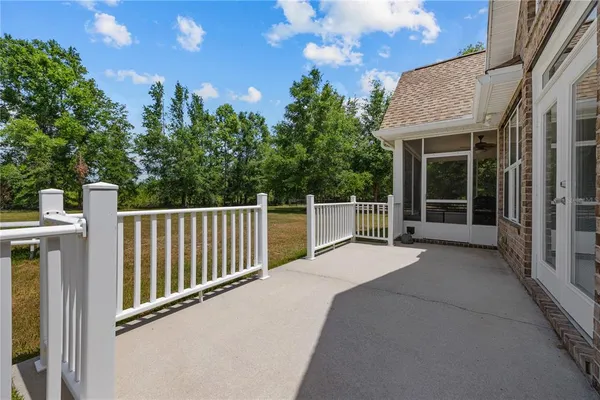 a view of a house with backyard and porch