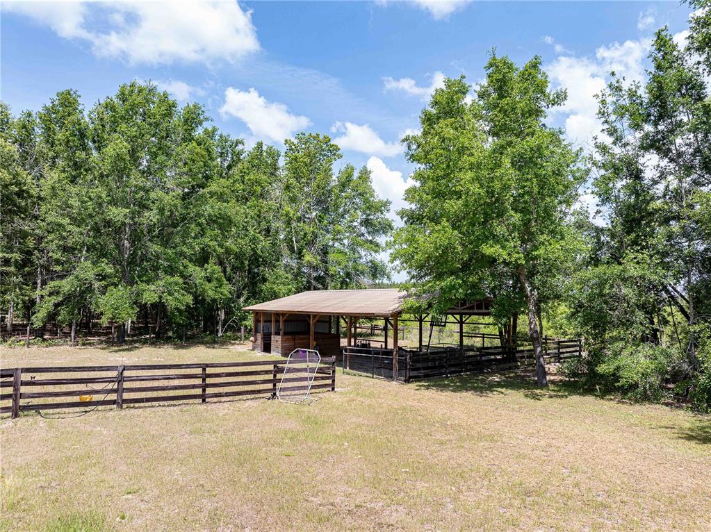 15527 194th Place O'Brien, FL 32071 - Photo 32 of 40 a view of a house with a yard
