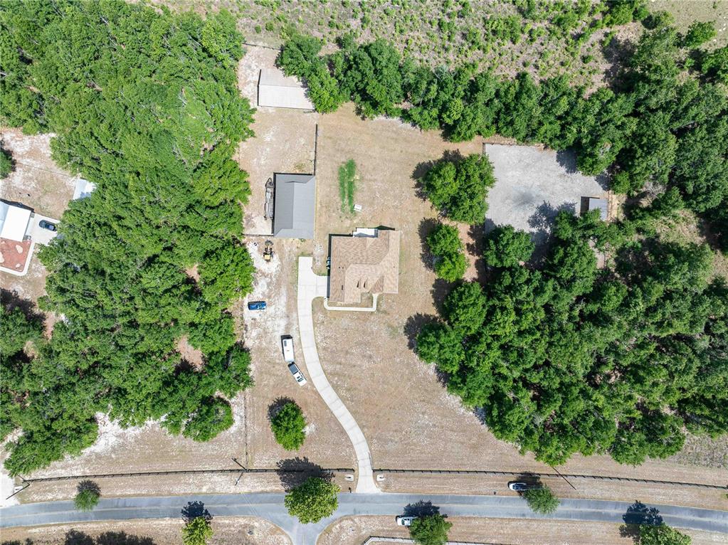 15527 194th Place O'Brien, FL 32071 - Photo 4 of 40 an aerial view of a house with a yard and large trees