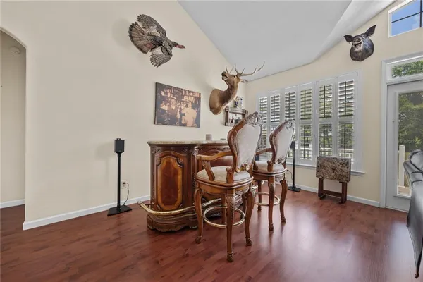 a view of a dining room with furniture window and wooden floor