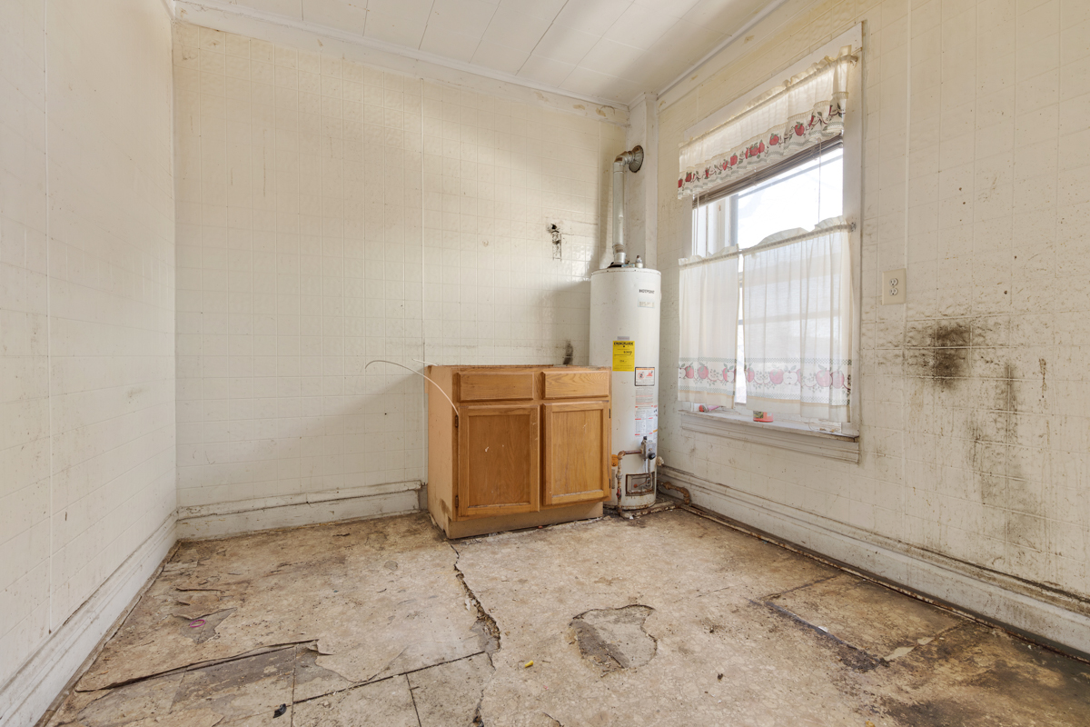1457 West Marquette Road Chicago, IL 60636 - Photo 18 of 26 a view of a room that has a stove and a window