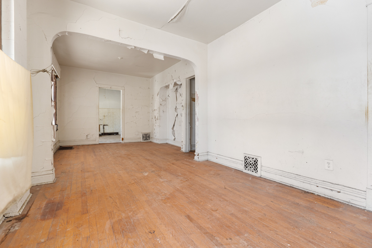 1457 West Marquette Road Chicago, IL 60636 - Photo 3 of 26 a view of empty room with wooden floor
