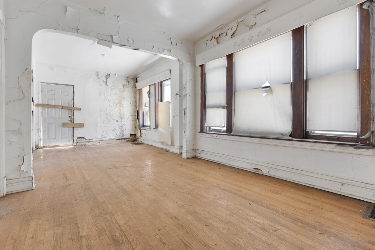 1457 West Marquette Road Chicago, IL 60636 - Photo 4 of 26 a view of a room with wooden floor