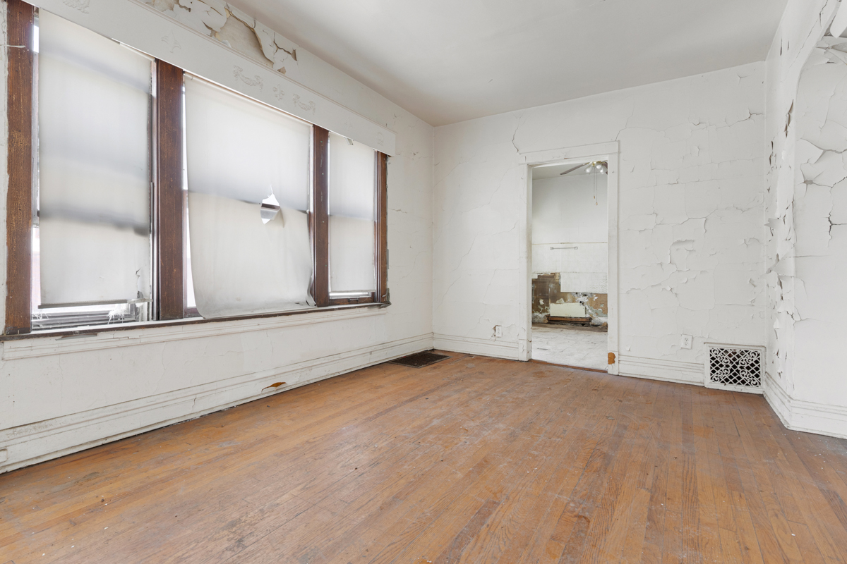 1457 West Marquette Road Chicago, IL 60636 - Photo 5 of 26 a view of an empty room with window and cabinet