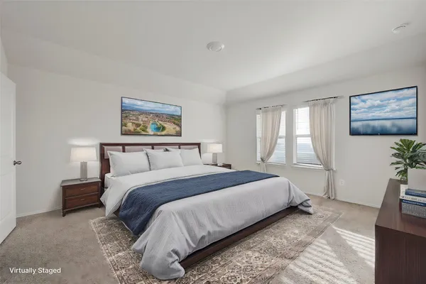 a bedroom with bed and window