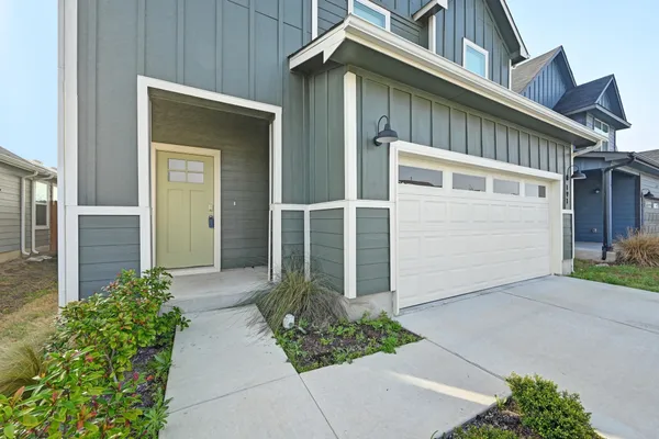 front view of a house with a small yard