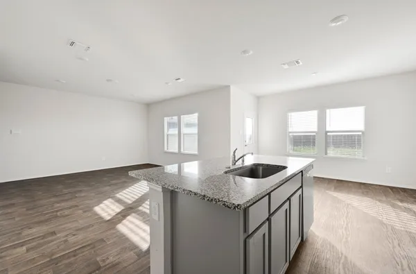 a kitchen with sink and window