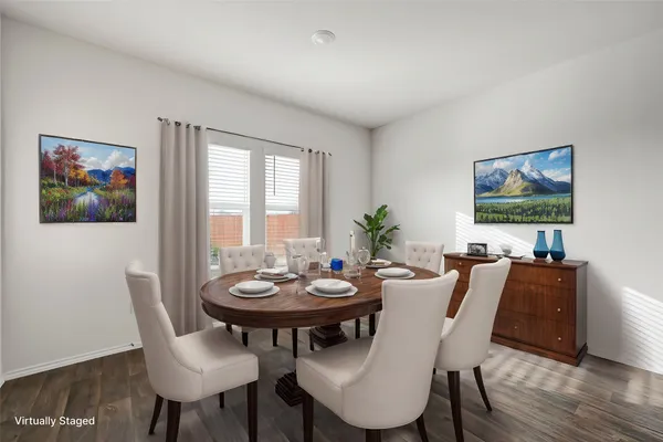 a view of a dining room with furniture and wooden floor