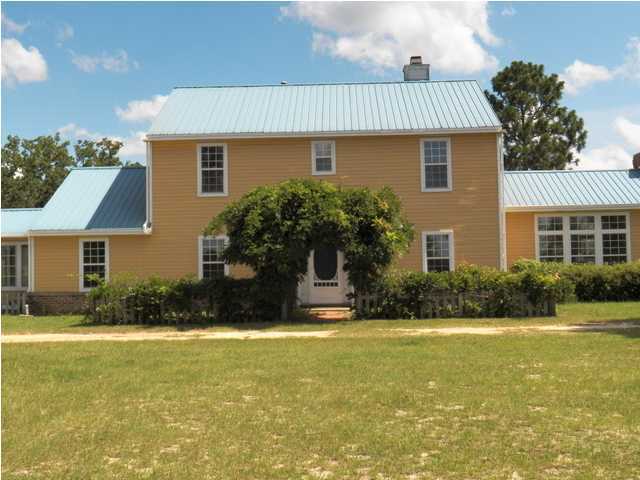 1490 Richardson Road DeFuniak Springs, FL 32433 - Photo 1 of 29 a front view of house with yard and green space