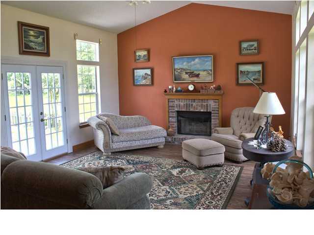 1490 Richardson Road DeFuniak Springs, FL 32433 - Photo 2 of 29 a living room with furniture and a fireplace