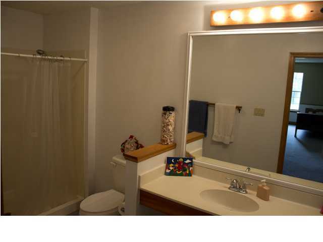 1490 Richardson Road DeFuniak Springs, FL 32433 - Photo 15 of 29 a bathroom with a sink and a mirror
