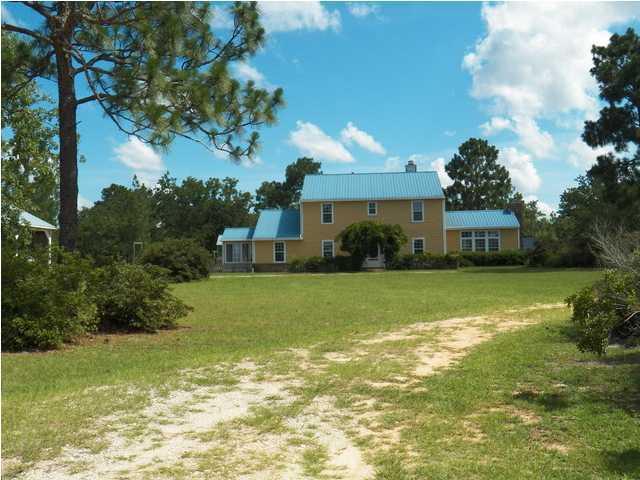 1490 Richardson Road DeFuniak Springs, FL 32433 - Photo 20 of 29 a front view of a house with a yard