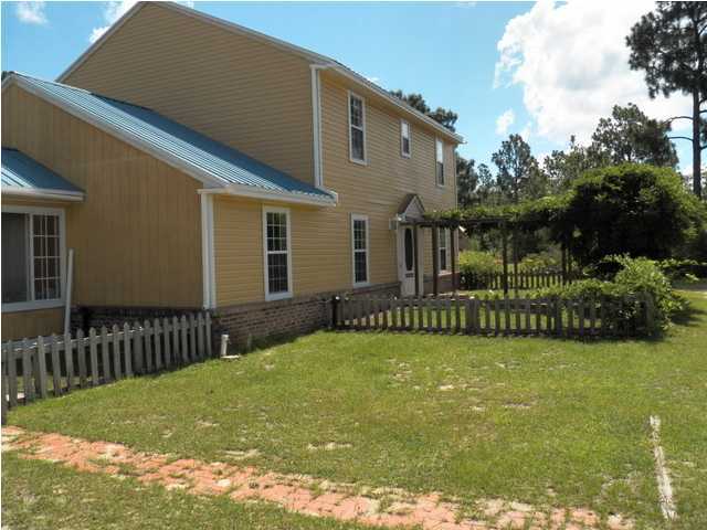 1490 Richardson Road DeFuniak Springs, FL 32433 - Photo 22 of 29 a view of a house with backyard and porch