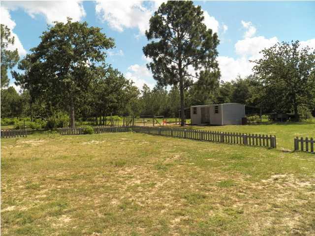 1490 Richardson Road DeFuniak Springs, FL 32433 - Photo 23 of 29 a view of a swimming pool with a yard