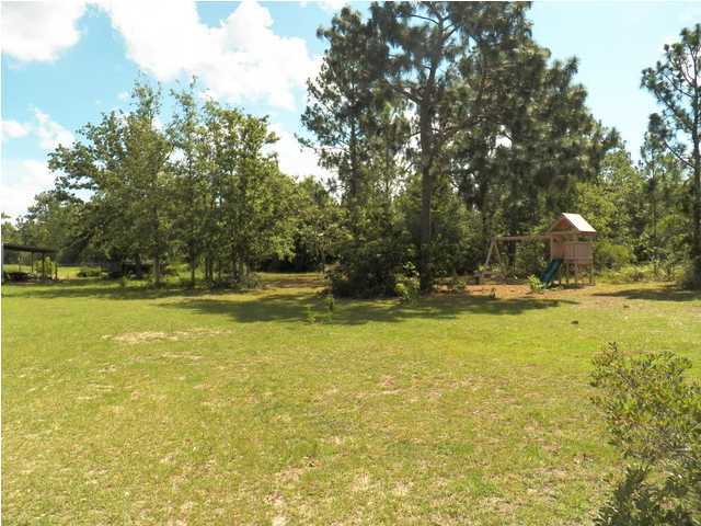 1490 Richardson Road DeFuniak Springs, FL 32433 - Photo 24 of 29 a view of a swimming pool with an outdoor space