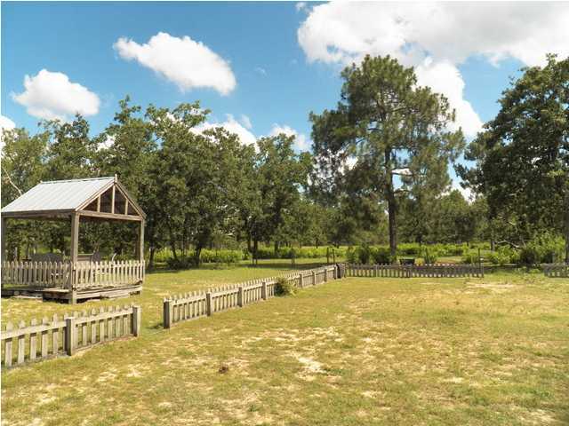 1490 Richardson Road DeFuniak Springs, FL 32433 - Photo 25 of 29 a view of a swimming pool with a patio