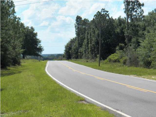 1490 Richardson Road DeFuniak Springs, FL 32433 - Photo 28 of 29 a view of a golf course with a lake
