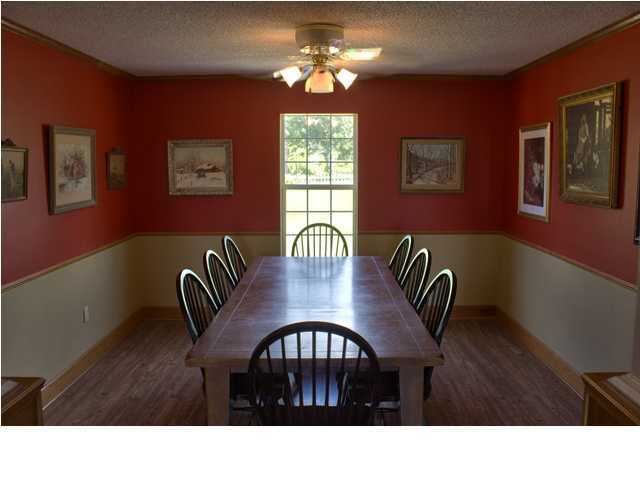1490 Richardson Road DeFuniak Springs, FL 32433 - Photo 5 of 29 a kitchen view with a dining table chairs and a chandelier