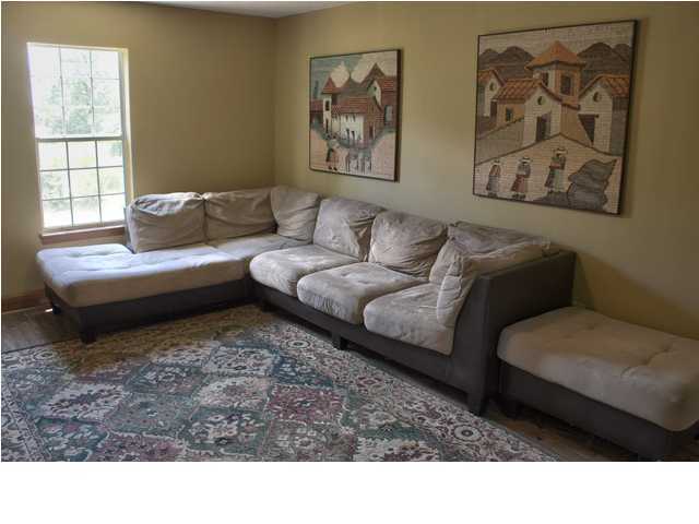 1490 Richardson Road DeFuniak Springs, FL 32433 - Photo 7 of 29 a living room with a couch and a window