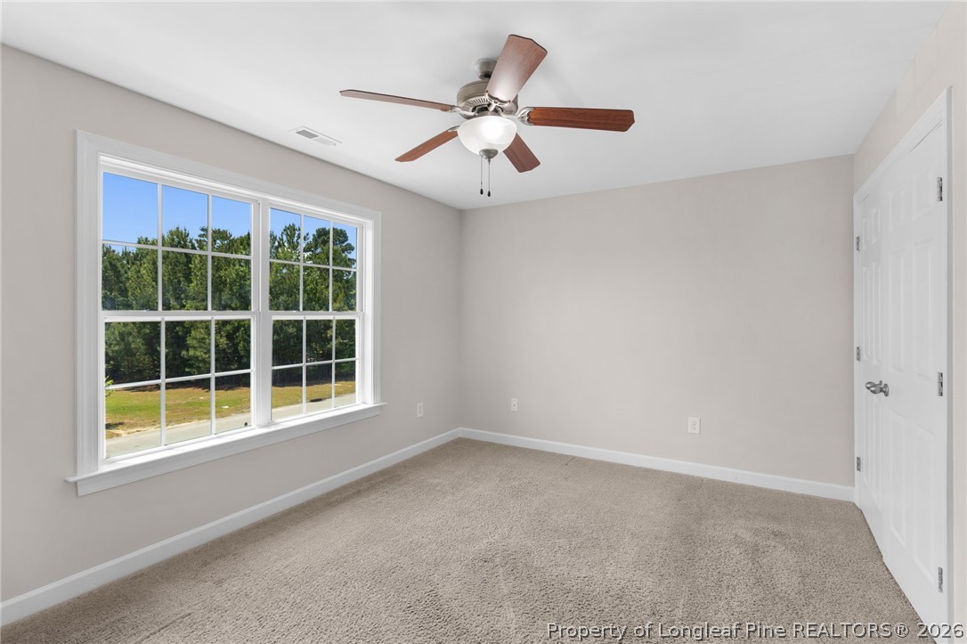 50 Huzzas Circle Cameron, NC 28326 - Photo 25 of 39 an empty room with window and ceiling fan