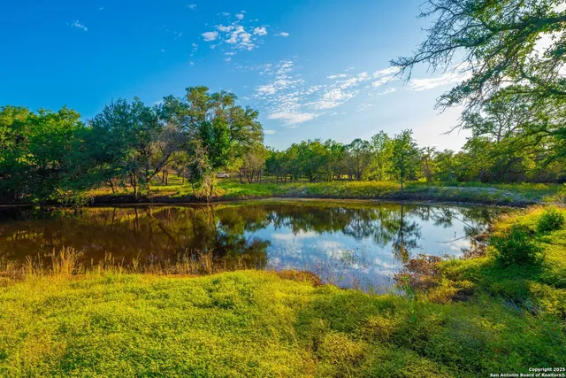 a view of a lake with a big yard