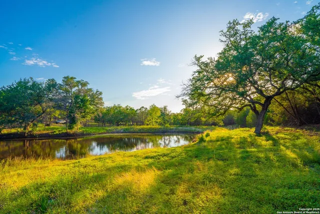 a view of a lake with houses in the back
