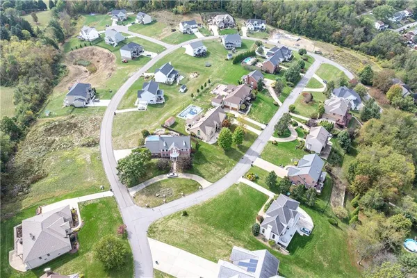 a view of a back yard from a balcony
