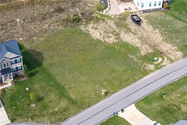 a view of a yard from a balcony