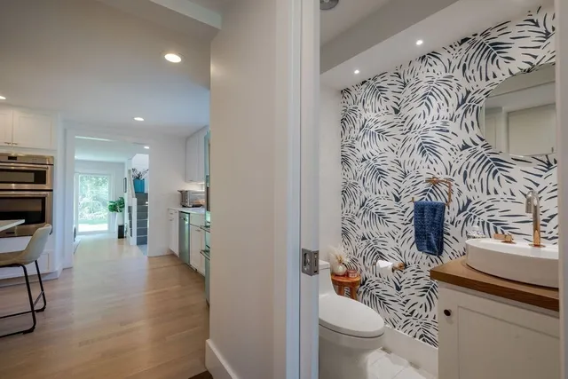 a view of a dining room with furniture and chandelier
