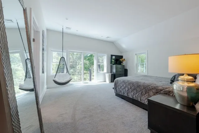 a bathroom with a tub a toilet and a sink