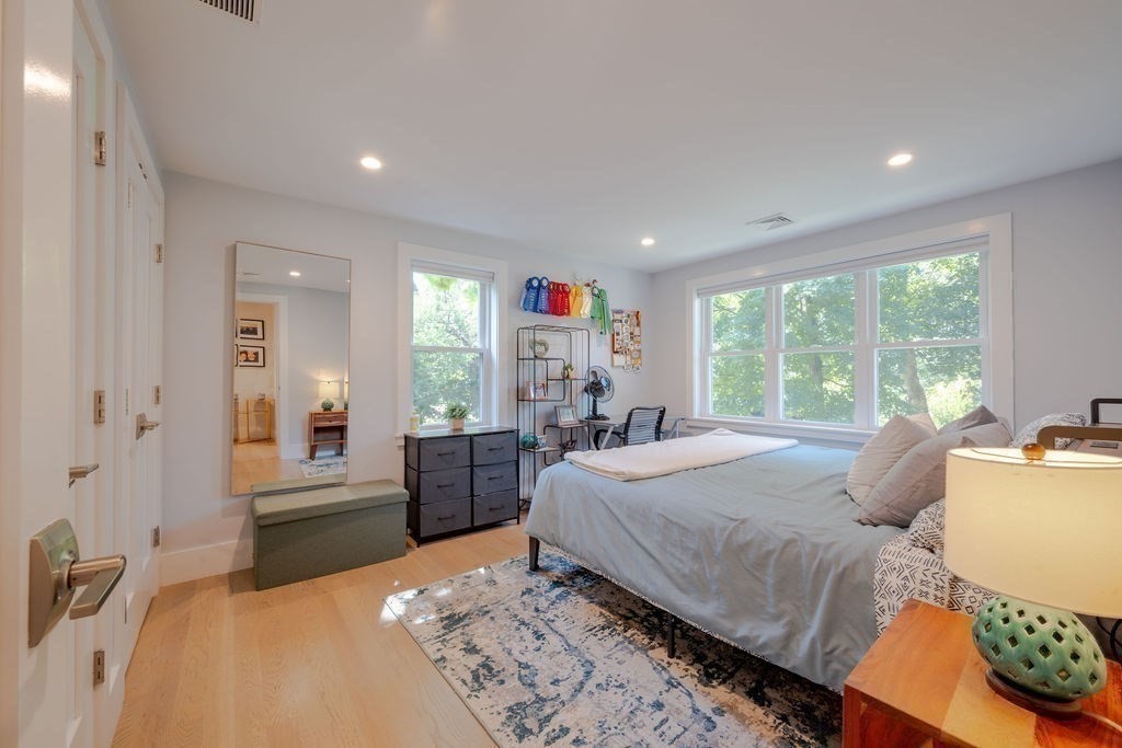 29 Water Street Natick, MA 01760 - Photo 22 of 42 a bedroom with a bed and wooden floor