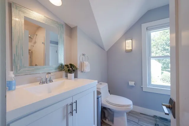 a view of a house with a yard and a garden