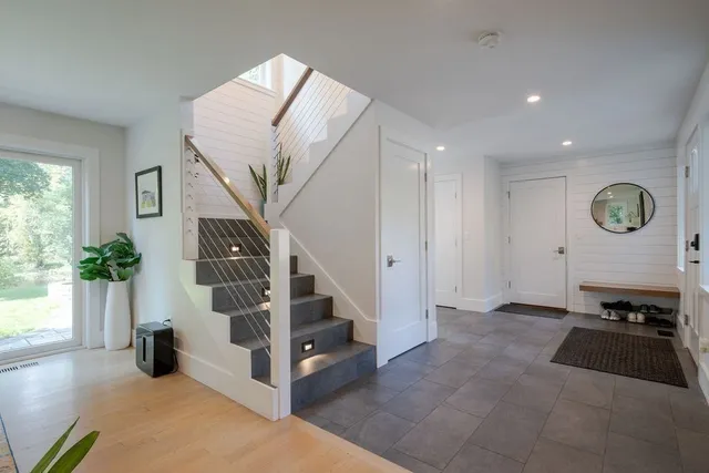 a view of a room with windows and closet
