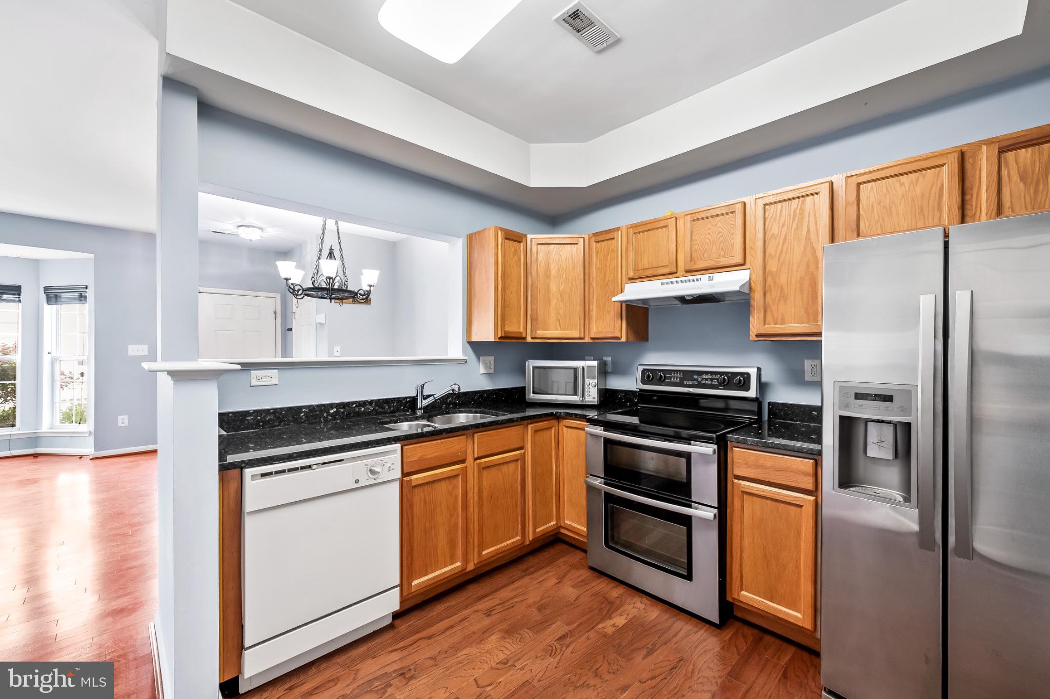 1913 Camelia Court Odenton, MD 21113 - Photo 12 of 26 a kitchen with a sink stove and refrigerator