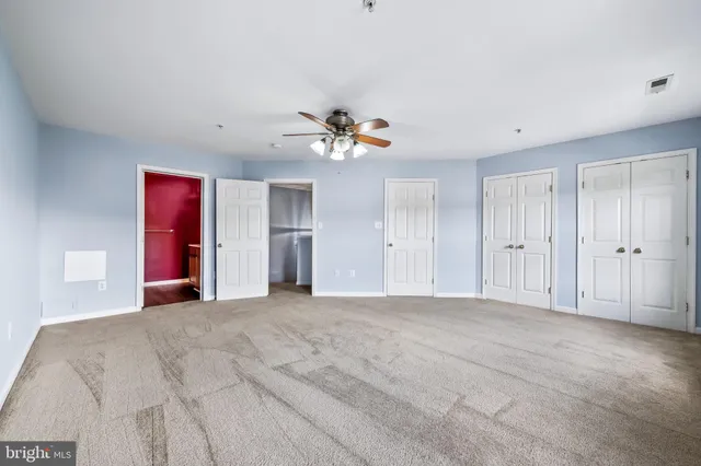 a bathroom with a bathtub shower sink and vanity