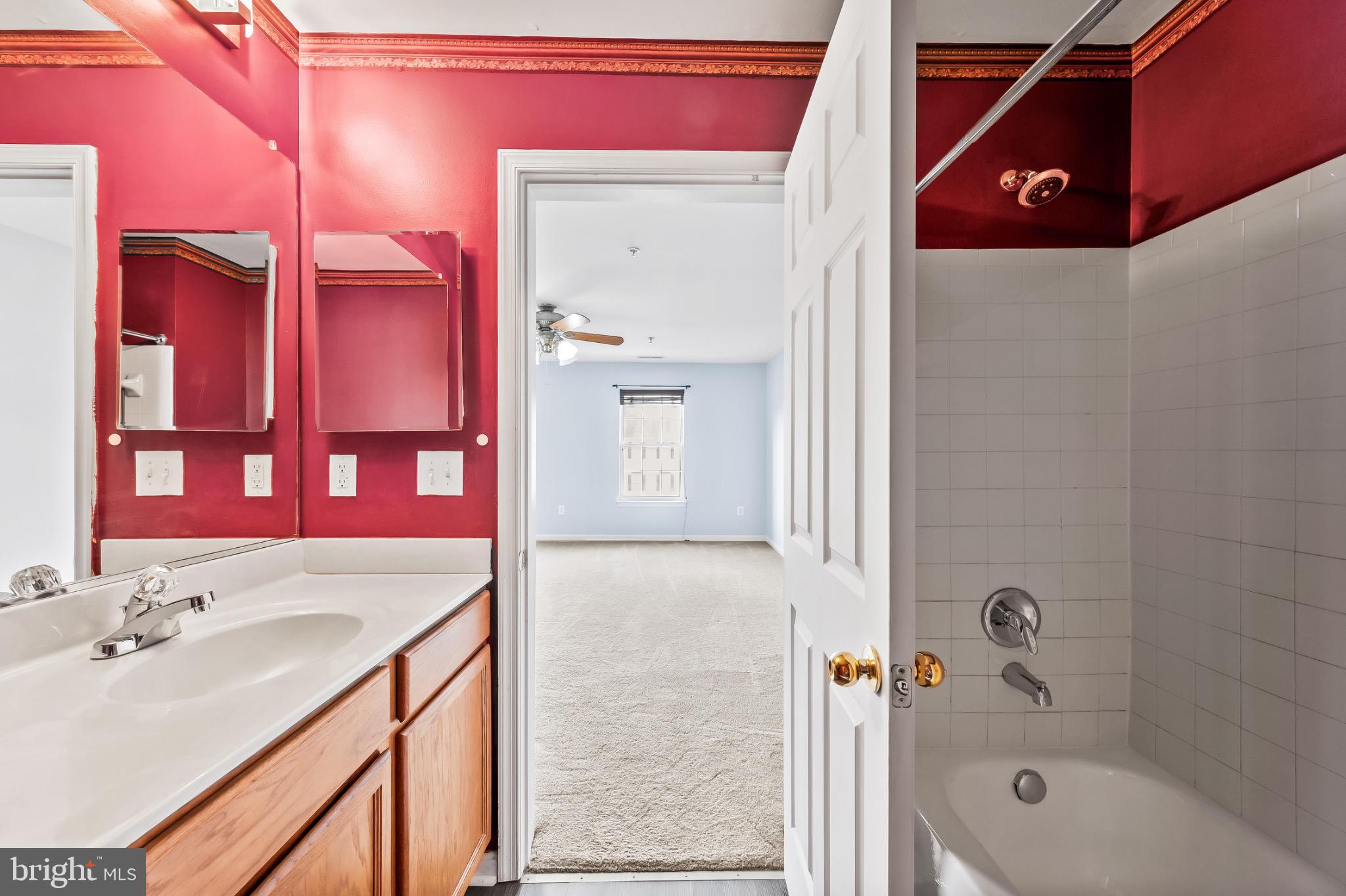 1913 Camelia Court Odenton, MD 21113 - Photo 25 of 26 a bathroom with a bathtub shower sink and vanity