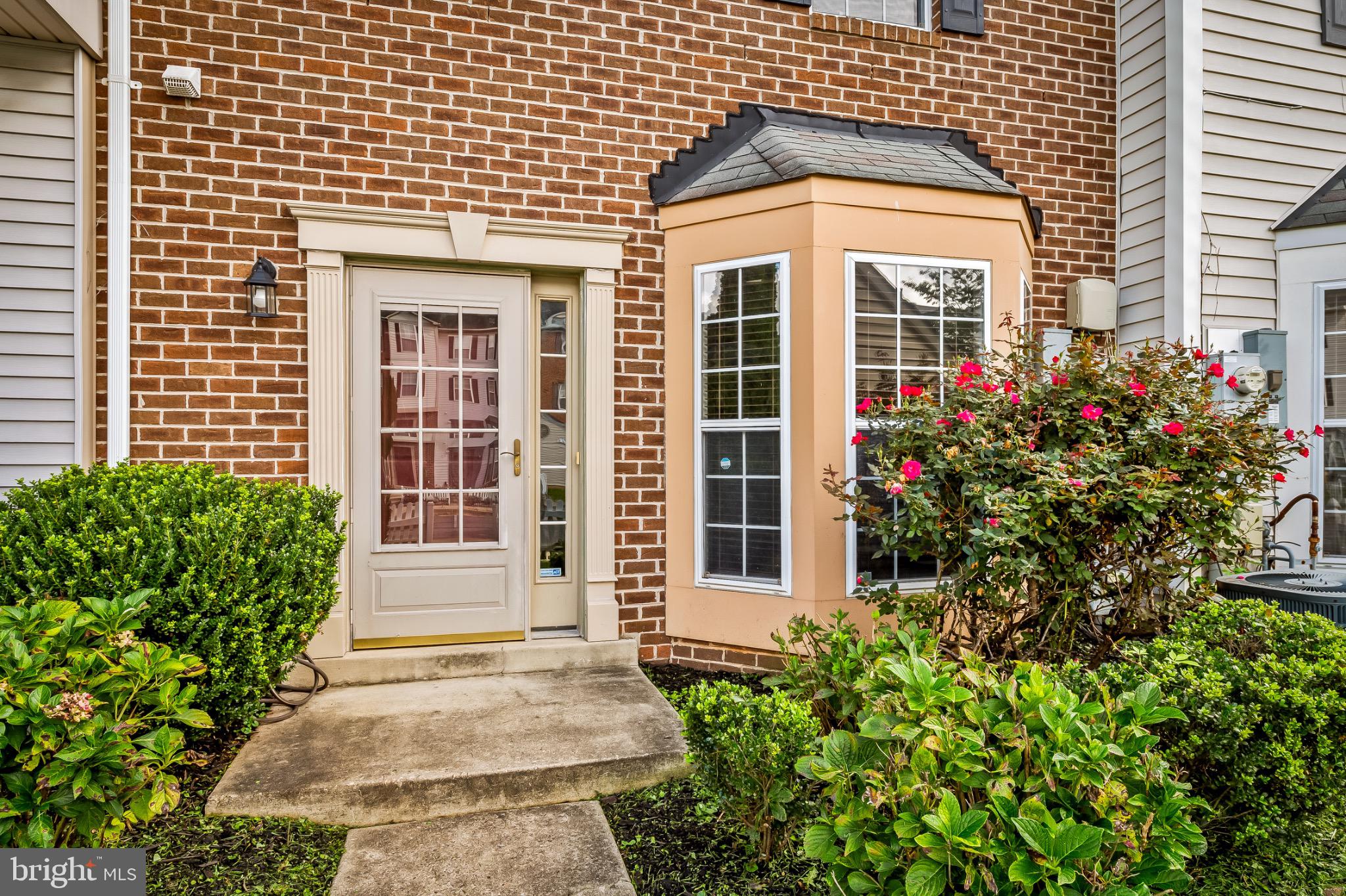1913 Camelia Court Odenton, MD 21113 - Photo 4 of 26 a view of a brick house with potted plants