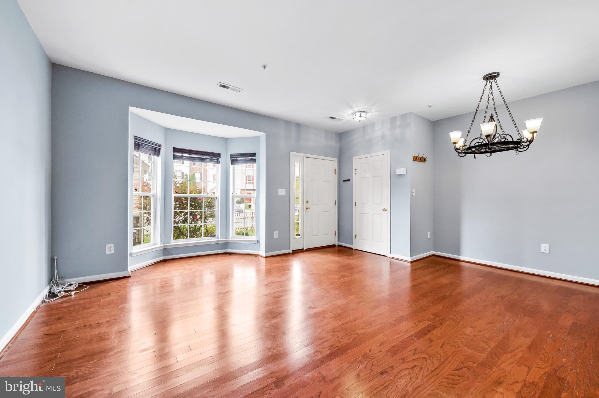 1913 Camelia Court Odenton, MD 21113 - Photo 6 of 26 a view of an empty room with window and wooden floor