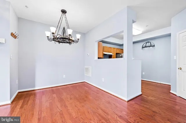 a kitchen with granite countertop a sink and cabinets