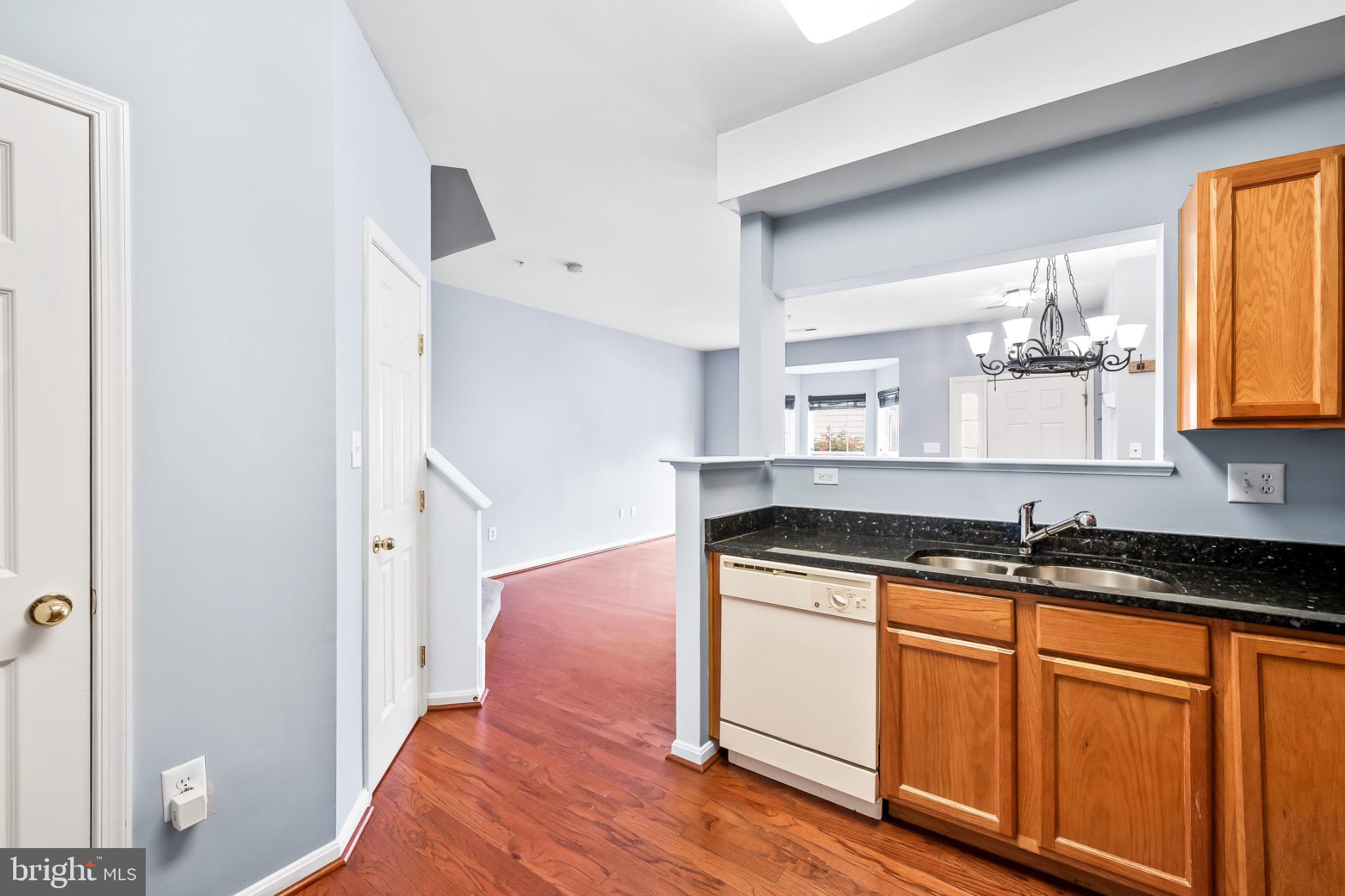 1913 Camelia Court Odenton, MD 21113 - Photo 10 of 26 a kitchen with granite countertop a sink and cabinets