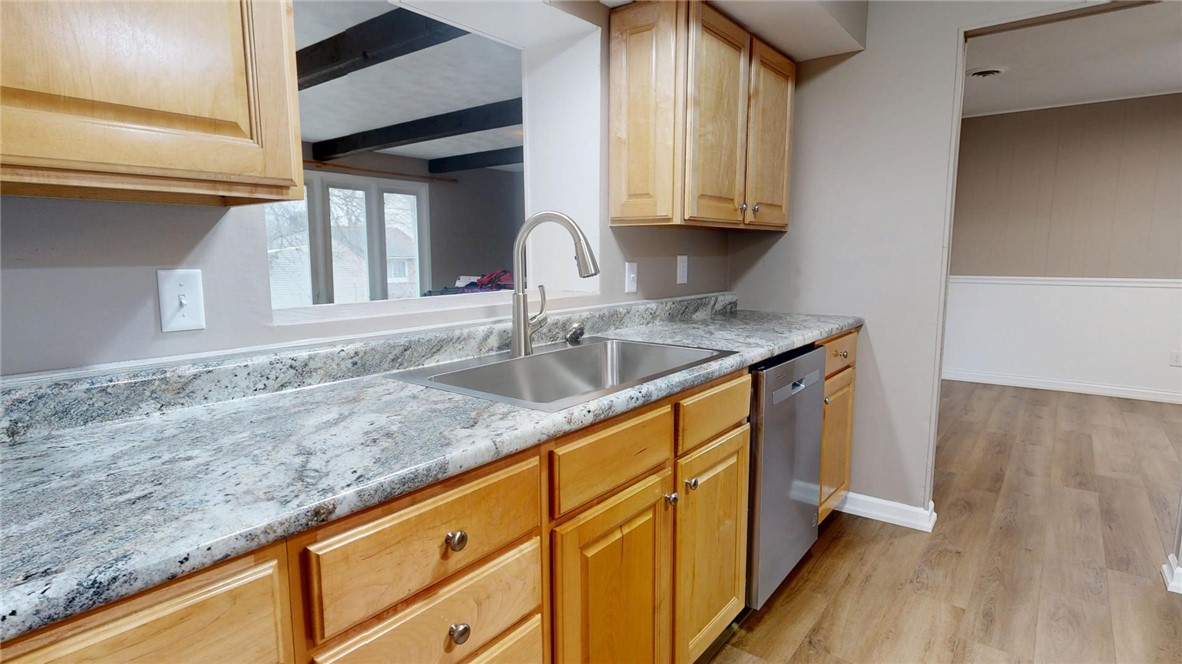 4153 Buckingham Drive Decatur, IL 62526 - Photo 6 of 34 a kitchen with granite countertop stainless steel appliances sink and cabinets