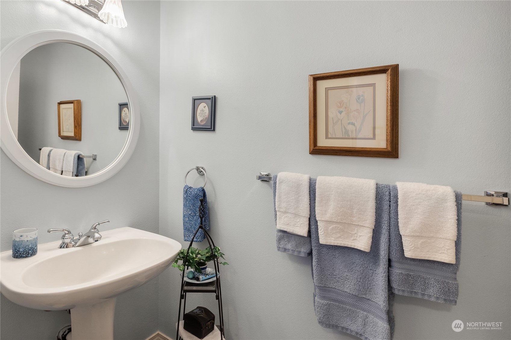 4601 Northeast 6th Court Renton, WA 98059 - Photo 16 of 40 a bathroom with a sink and a mirror