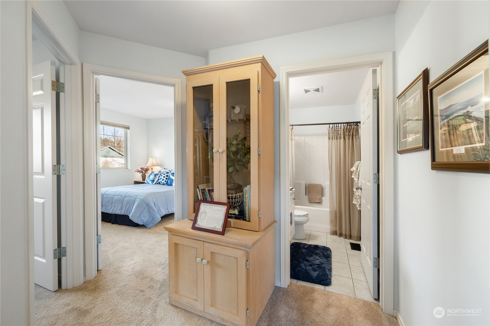 4601 Northeast 6th Court Renton, WA 98059 - Photo 28 of 40 a en suite spacious bedroom with a bed and a couch