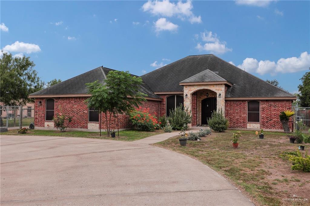 1617 Mon Mack Road Edinburg, TX 78541 - Photo 1 of 1 View of front of property featuring brick siding and roof with shingles