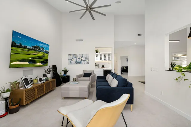 a kitchen with stainless steel appliances a refrigerator sink and microwave