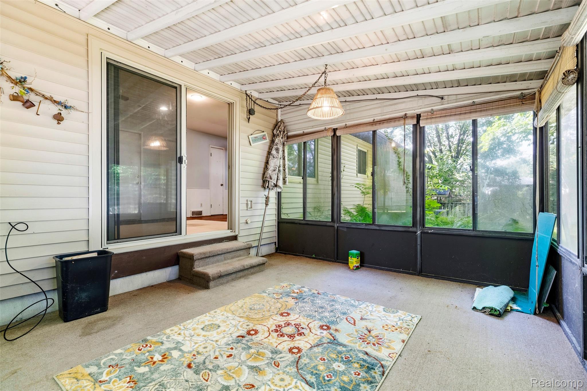 309 Windy Bluff Street Flushing, MI 48433 - Photo 10 of 32 Enclosed sunroom with concrete flooring and a paneled ceiling