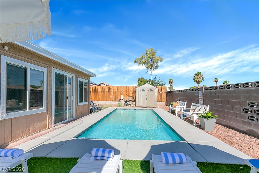 101 Beaver Ridge Avenue North Las Vegas, NV 89031 - Photo 34 of 42 An inviting backyard oasis offers a sparkling in-ground pool and ample space for outdoor enjoyment.