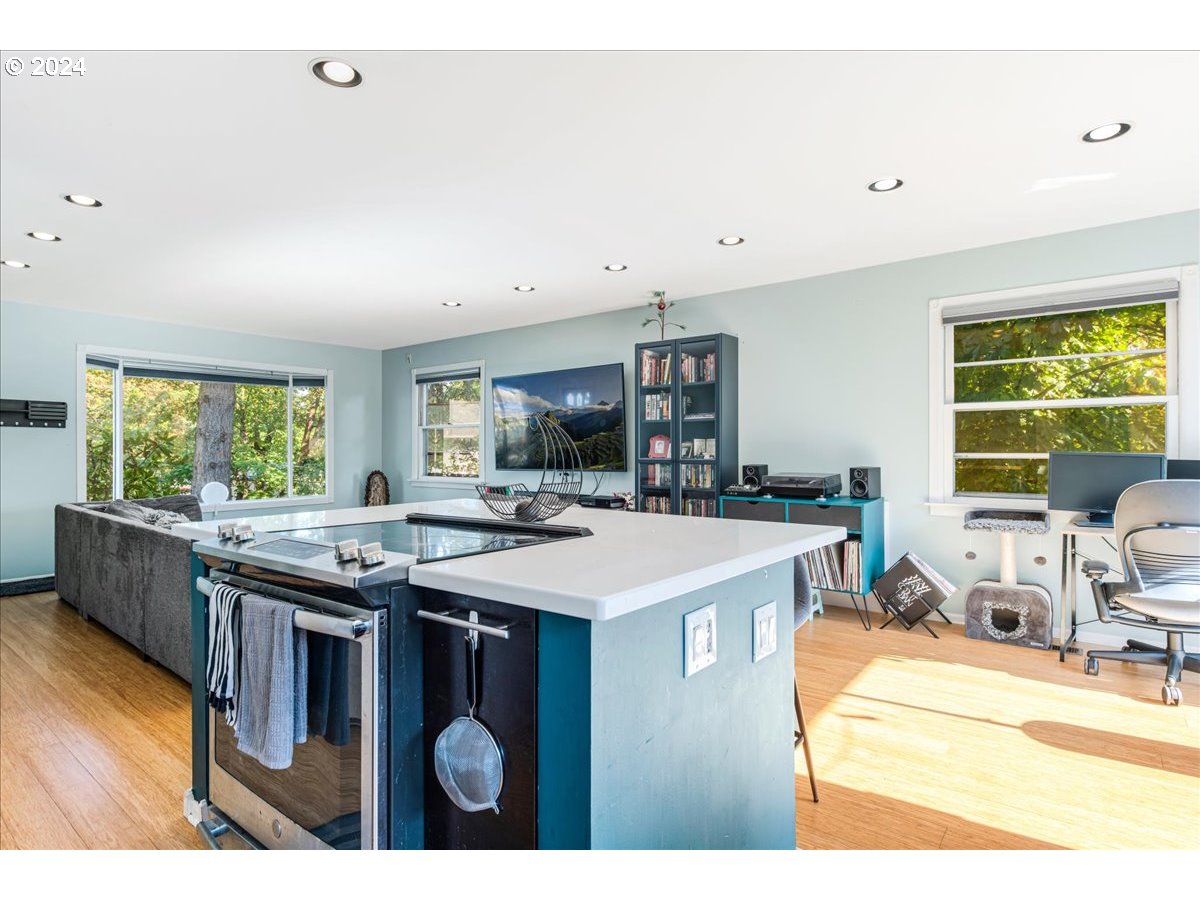 2675 Southwest Spring Garden Street Portland, OR 97219 - Photo 17 of 31 a kitchen with a stove and a refrigerator