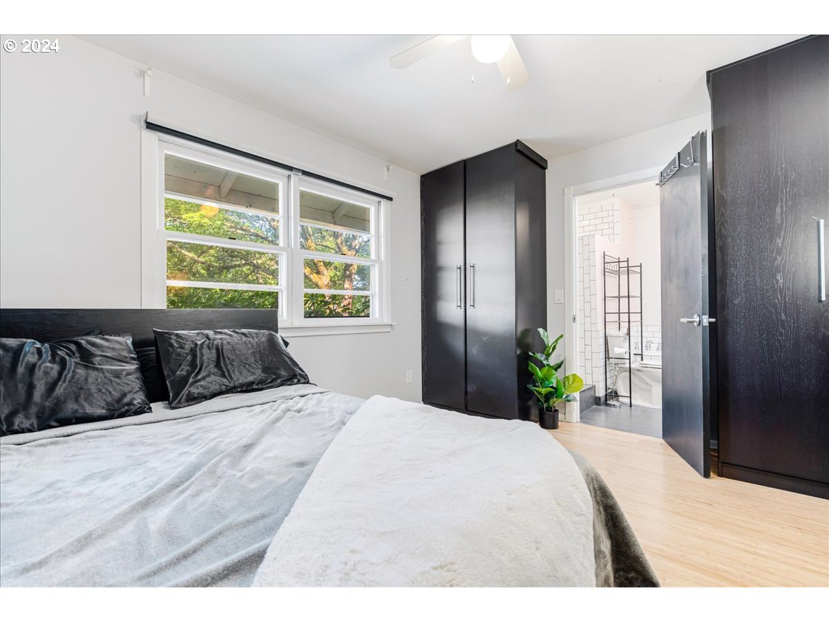 2675 Southwest Spring Garden Street Portland, OR 97219 - Photo 22 of 31 a bed sitting in a bedroom next to a window
